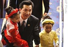 Anh 'Joseph' Cao with his daughters Betsy, 4, left, and Sophia, 5, dressed in traditional Vietnamese clothing, in the House of Representatives on Tuesday