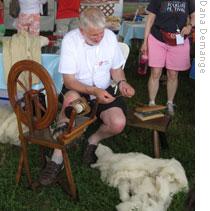A man from Wales making wool thread
