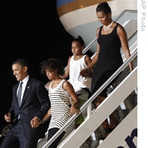 The President and first Lady Michelle Obama arrive in Accra, Ghana, with daughters Sasha and Malia 