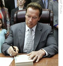 Governor Arnold Schwarzenegger signing the state budget on Tuesday