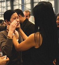 Journalist Laura Ling cries as she talks with sister/journalist Lisa Ling after arriving at Hangar 25 in Burbank, California, 05 Aug 2009