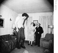 Diane Arbus' photo of a giant man at home with his parents in the Bronx, New York