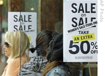 Sale signs on the store window of a shop in Santa Monica, California