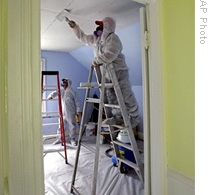 Workers clean up lead paint at a building in Providence, Rhode Island in 2006.