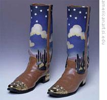 Two porcelain cowboy boots by William Wilhelmi